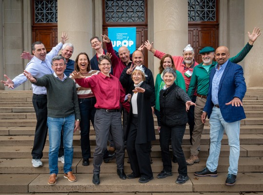Fourteen UPOP mentors together on the steps of MIT campus